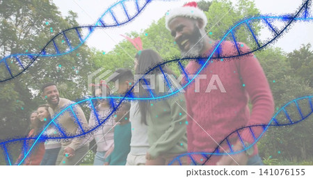 Walking man in red sweater Santa hat linking arms across park, DNA graphic, copy space Walking man in red sweater Santa hat linking arms across park, DNA graphic, copy space 141076155