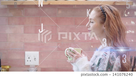 Holding mug smelling aroma woman fuzzy-sweater zigzag-band standing kitchen pink tile, copy space Holding mug smelling aroma woman fuzzy-sweater zigzag-band standing kitchen pink tile, copy space 141076240