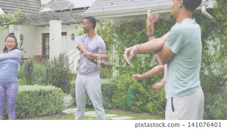 Stretching small group wearing athletic clothing in front yard, showing solar panels and earbuds Stretching small group wearing athletic clothing in front yard, showing solar panels and earbuds 141076401