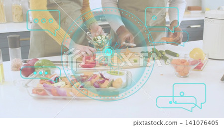 Chopping two adults wearing aprons slicing veggies at kitchen counter with board, knife, AI overlay Chopping two adults wearing aprons slicing veggies at kitchen counter with board, knife, AI overlay 141076405