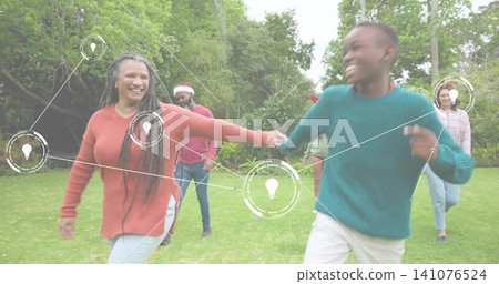Holding hands, woman with braids walking with boy across park lawn, sweaters, Santa hat, idea nodes Holding hands, woman with braids walking with boy across park lawn, sweaters, Santa hat, idea nodes 141076524