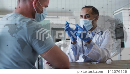 Holding syringe, physician in white coat, blue gloves discussing vaccine at clinic desk, copy space Holding syringe, physician in white coat, blue gloves discussing vaccine at clinic desk, copy space 141076526