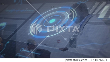 Reviewing clinical team examining data at hospital desk with HUD, surgical cap, scrubs, stethoscope Reviewing clinical team examining data at hospital desk with HUD, surgical cap, scrubs, stethoscope 141076601