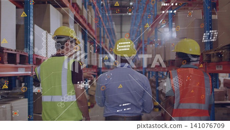 Walking workers inspecting racks with AR overlay in depot, with yellow hard hats and hi-vis vests Walking workers inspecting racks with AR overlay in depot, with yellow hard hats and hi-vis vests 141076709