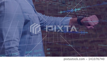 Extending man in light-blue shirt gesturing at brick wall with smartwatch and HUD charts Extending man in light-blue shirt gesturing at brick wall with smartwatch and HUD charts 141076740