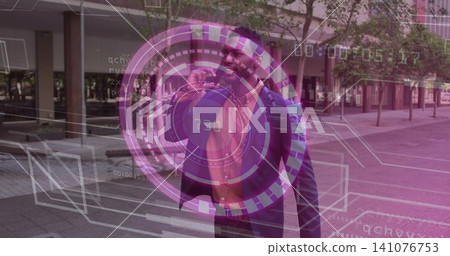 Holding smartphone near ear, adult man in business attire interacting with AR HUD at urban plaza 141076753