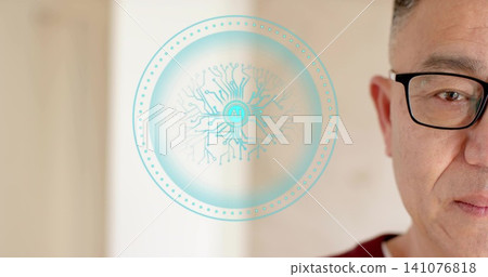 Gazing senior Chinese man wearing maroon sweater black glasses in home cyan AI hologram, copy space Gazing senior Chinese man wearing maroon sweater black glasses in home cyan AI hologram, copy space 141076818