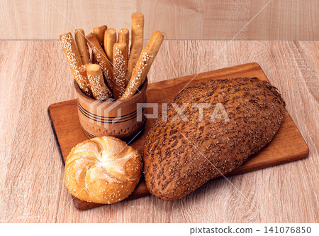 fresh bread on the wooden background fresh bread on the wooden background 141076850