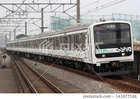 A 209 series MUE-Train passing through Minami-Yono. 141077588