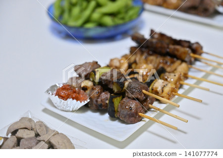Home drinking set for summer evenings: Yakitori, edamame, and alcohol. Home drinking set for summer evenings: Yakitori, edamame, and alcohol. 141077774