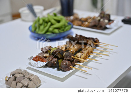 Home drinking set for summer evenings: Yakitori, edamame, and alcohol. Home drinking set for summer evenings: Yakitori, edamame, and alcohol. 141077776