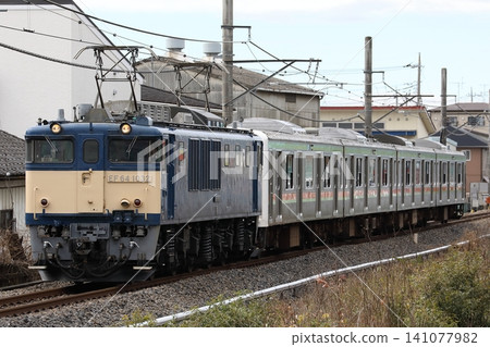 EF64-1032 hauls a 209 series 3000 series train from the Hachiko Line, being sent for scrapping, on the Kawagoe Line. EF64-1032 hauls a 209 series 3000 series train from the Hachiko Line, being sent for scrapping, on the Kawagoe Line. 141077982