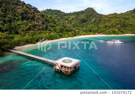 Aerial view of tropical beach landscape with helipad at Nyaung Oo Phee island in Myanmar Aerial view of tropical beach landscape with helipad at Nyaung Oo Phee island in Myanmar 141078172