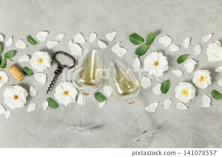 Wine Glasses with Roses, Corkscrew, and Petals Flat Lay Wine Glasses with Roses, Corkscrew, and Petals Flat Lay 141078557