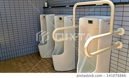 Barrier-free public toilet urinal with handrails Barrier-free public toilet urinal with handrails 141078866