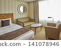 Hotel room with sofa and large window 141078946