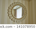Designer mirrors displayed on the walls of hotel rooms 141078950