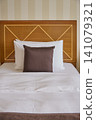 Clean bed in a hotel room 141079321