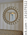 Designer mirrors displayed on the walls of hotel rooms 141079322