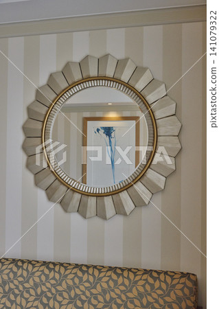 Designer mirrors displayed on the walls of hotel rooms Designer mirrors displayed on the walls of hotel rooms 141079322