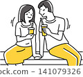 A man and a woman gaze at each other, drinks in hand. 141079326