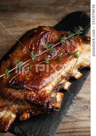 Delicious roasted ribs served on wooden table 141079436