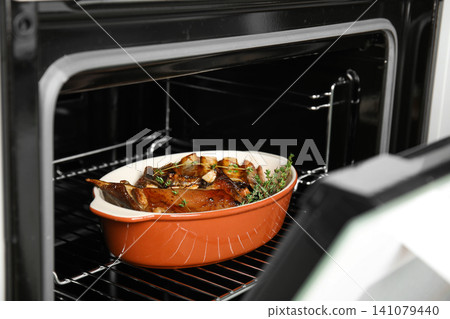 Delicious roasted ribs with thyme in oven Delicious roasted ribs with thyme in oven 141079440