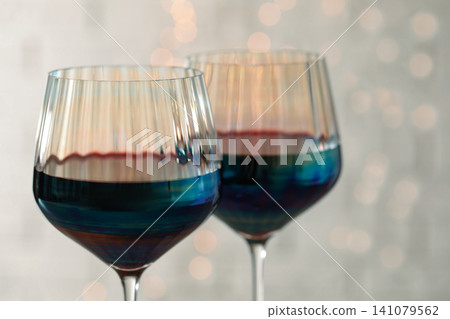 Glasses of red wine on light background, closeup Glasses of red wine on light background, closeup 141079562