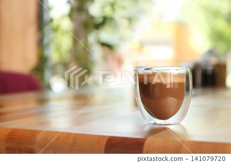 Aromatic coffee on wooden table in cafe. Space for text Aromatic coffee on wooden table in cafe. Space for text 141079720