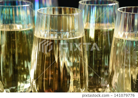 Closeup view of glasses with sparkling wine Closeup view of glasses with sparkling wine 141079776