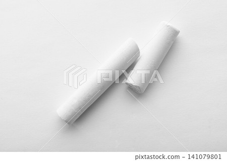 Pieces of chalk on white background, top view Pieces of chalk on white background, top view 141079801