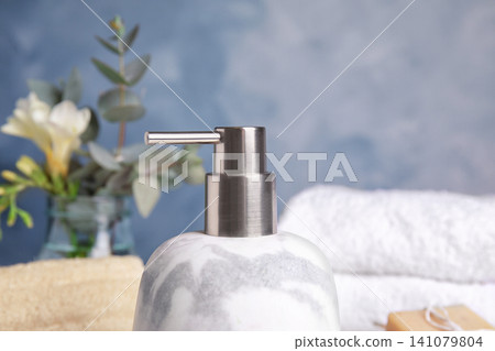 Modern marble soap dispenser in bathroom, closeup Modern marble soap dispenser in bathroom, closeup 141079804