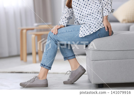 Woman wearing black tights and stylish shoes on light grey background, closeup of legs Woman wearing black tights and stylish shoes on light grey background, closeup of legs 141079916