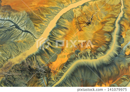 Surreal colorful natural pattern of mining waste waters in decanting lake aerial view 141079975