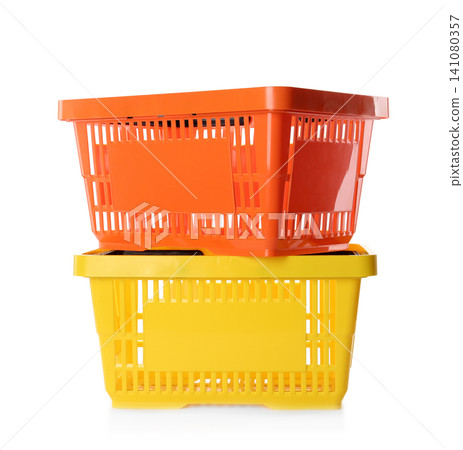 Color plastic shopping baskets isolated on white Color plastic shopping baskets isolated on white 141080357