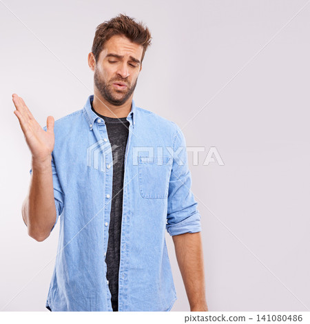 Smell, man and waving his hands for bad stink, poor hygiene and negative aroma on white studio background. Face, person or model with gesture or body odor with fart and disgust with yuck expression 141080486