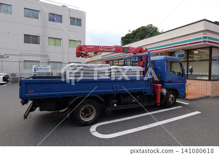 a truck from a construction site near the store in Japan a truck from a construction site near the store in Japan 141080618