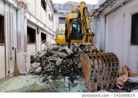 Bulldozer Demolishing Old Building at Construction Site in Japan Bulldozer Demolishing Old Building at Construction Site in Japan 141080619