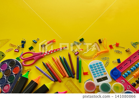 Colorful School Supplies And Stationery On Yellow Background Colorful School Supplies And Stationery On Yellow Background 141080866