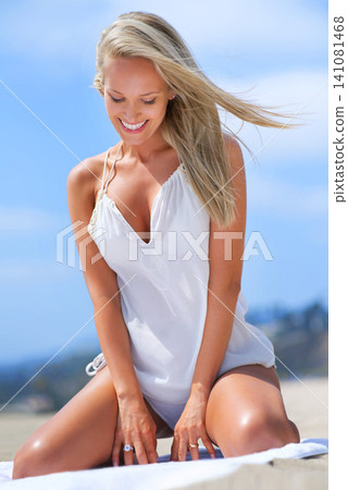 Beach, smile and woman on towel with thinking for summer travel, vacation and relax with happiness. Nature, holiday and German person at seaside for weekend getaway, sun tan and tourism in Bali 141081468