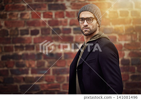 Man, portrait and urban fashion by brick wall downtown for aesthetic, modern and expression for city culture. Male person, trendy winter outfit for streetwear style for creative career in retail Man, portrait and urban fashion by brick wall downtown for aesthetic, modern and expression for city culture. Male person, trendy winter outfit for streetwear style for creative career in retail 141081496