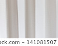 Beautiful white curtain fabric texture background with vertical pleats and soft shadows. 141081507