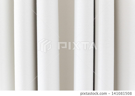 Beautiful white curtain fabric texture background with vertical pleats and soft shadows. Beautiful white curtain fabric texture background with vertical pleats and soft shadows. 141081508