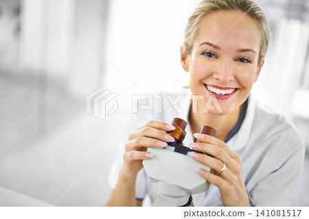 Happy woman, portrait and scientist with microscope for biology, chemistry or forensics at lab. Face of female person or medical expert with smile for test, exam or scientific research at laboratory 141081517
