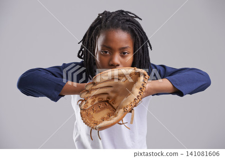 Sports, baseball and portrait of kid on gray background with glove for training, practice and match. Fitness, youth and young boy with equipment for exercise, playing games and competition in studio Sports, baseball and portrait of kid on gray background with glove for training, practice and match. Fitness, youth and young boy with equipment for exercise, playing games and competition in studio 141081606