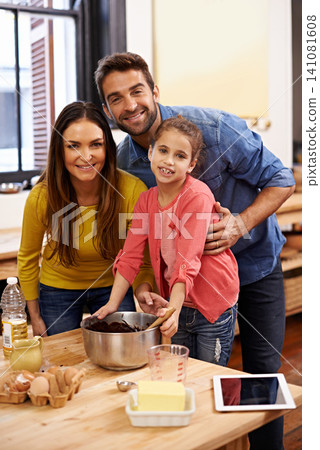 Parents, kid and baking with tablet for recipe online with ingredients for cake or dessert with support and handmade. Mom, dad and girl child in kitchen together with love for bonding or teaching. Parents, kid and baking with tablet for recipe online with ingredients for cake or dessert with support and handmade. Mom, dad and girl child in kitchen together with love for bonding or teaching. 141081608