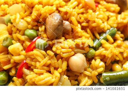 Delicious rice pilaf with vegetables as background, closeup Delicious rice pilaf with vegetables as background, closeup 141081631