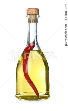 Cooking oil with chili pepper in glass bottle isolated on white Cooking oil with chili pepper in glass bottle isolated on white 141081653