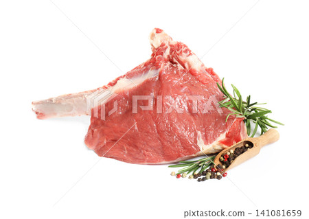 Raw rib with herbs and pepper isolated on white Raw rib with herbs and pepper isolated on white 141081659