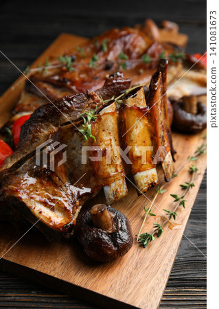 Delicious roasted ribs served on table, closeup 141081673